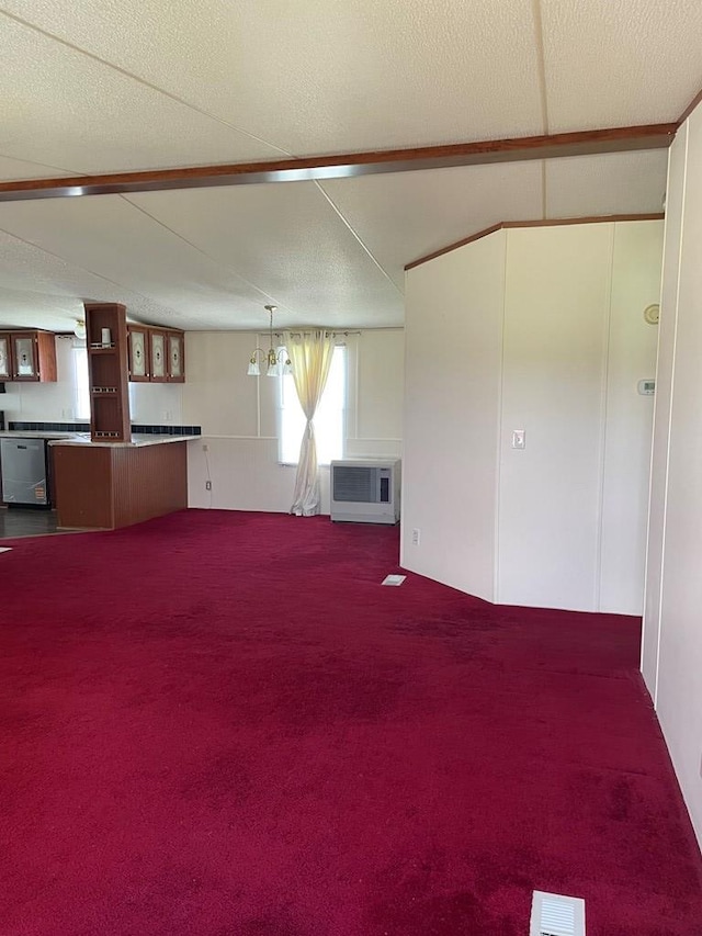 91 Dameron Dr, Hague, VA 22469 - unfurnished living room featuring dark colored carpet and heating unit
