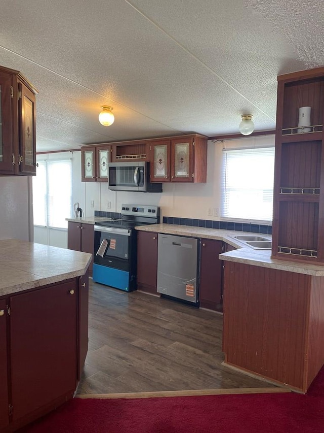91 Dameron Dr, Hague, VA 22469 - kitchen featuring stainless steel appliances, healthy amount of natural light, a textured ceiling, open shelves, and dark wood-style floors