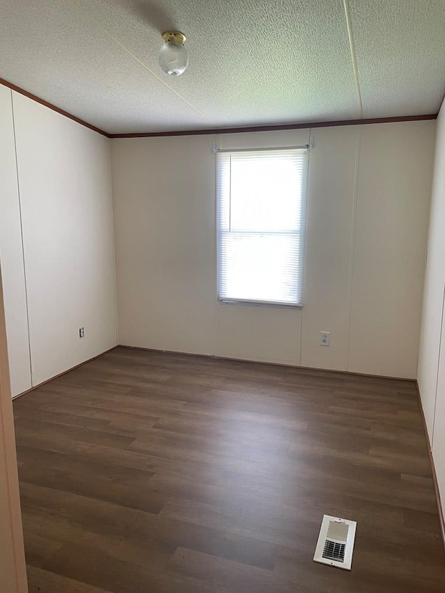 91 Dameron Dr, Hague, VA 22469 - unfurnished room featuring wood finished floors and a textured ceiling