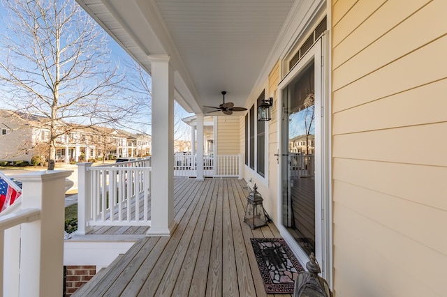 wooden deck with ceiling fan and a porch