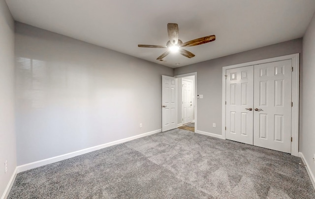 unfurnished bedroom with a closet, ceiling fan, and carpet flooring