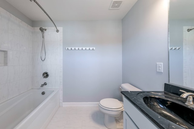 full bathroom with tiled shower / bath combo, vanity, and toilet