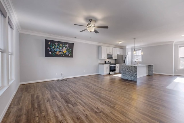 unfurnished living room featuring sink, crown molding, dark wood-type flooring, and ceiling fan