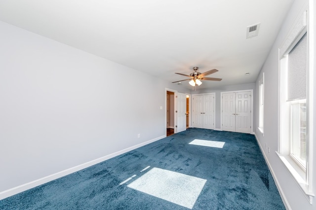 carpeted empty room with ceiling fan