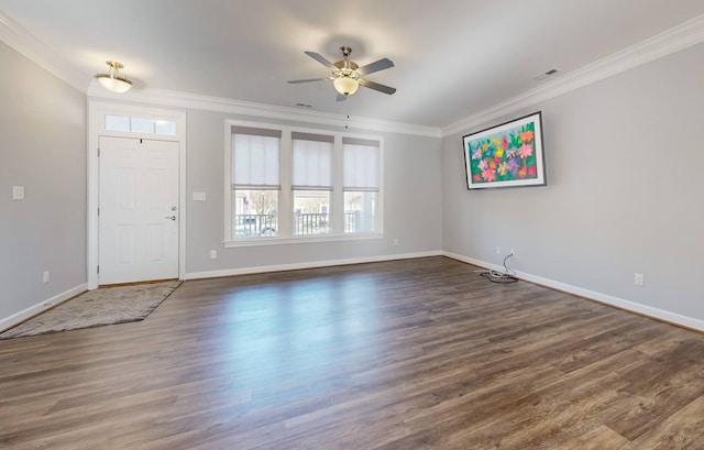 foyer entrance featuring crown molding, dark wood-type flooring, and ceiling fan