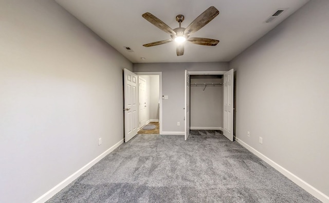 unfurnished bedroom with light colored carpet, ceiling fan, and a closet