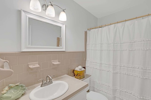 94 Arcadia Dr, Newport News, VA 23608 - bathroom featuring vanity, tile walls, curtained shower, and a wainscoted wall