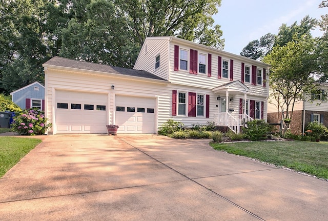 94 Arcadia Dr, Newport News, VA 23608 - colonial-style house with concrete driveway, an attached garage, and a front yard