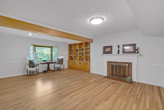 94 Arcadia Dr, Newport News, VA 23608 - living area with a textured ceiling, light wood-type flooring, and a brick fireplace