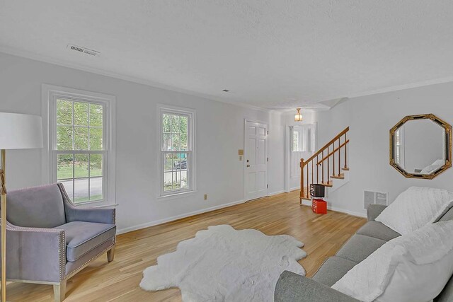 94 Arcadia Dr, Newport News, VA 23608 - living area featuring stairway, ornamental molding, and wood finished floors