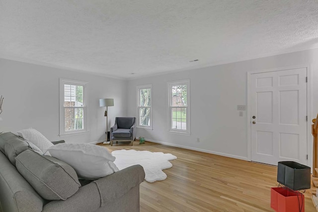 94 Arcadia Dr, Newport News, VA 23608 - living room featuring a textured ceiling and light wood-style floors
