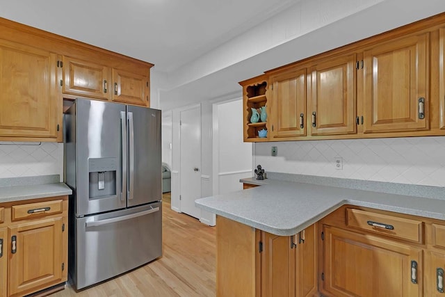 94 Arcadia Dr, Newport News, VA 23608 - kitchen featuring stainless steel refrigerator with ice dispenser, light countertops, tasteful backsplash, open shelves, and light wood-style floors