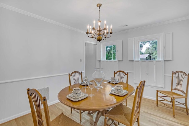 94 Arcadia Dr, Newport News, VA 23608 - dining area featuring a chandelier, light wood-style floors, crown molding, and a wainscoted wall