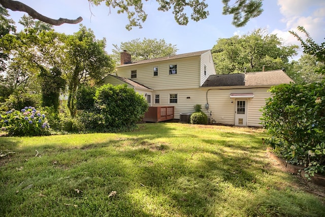 94 Arcadia Dr, Newport News, VA 23608 - back of property featuring a chimney and a lawn
