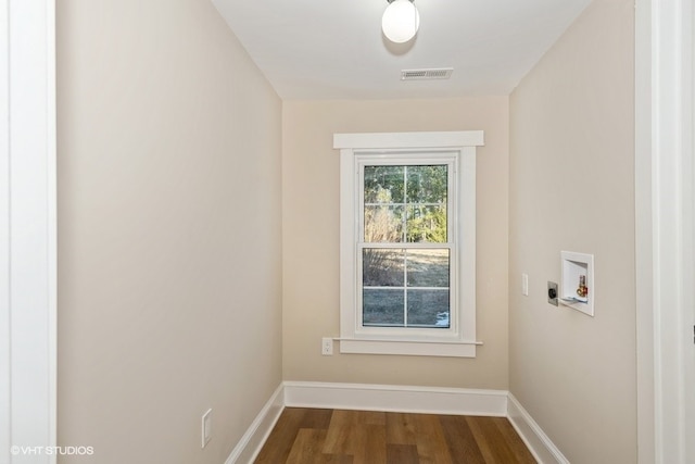 interior space featuring laundry area, visible vents, wood finished floors, washer hookup, and electric dryer hookup