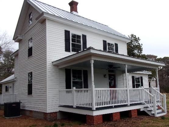 293 Mila Rd, Heathsville, VA 22473 - view of front of house featuring a porch, crawl space, a chimney, cooling unit, and metal roof