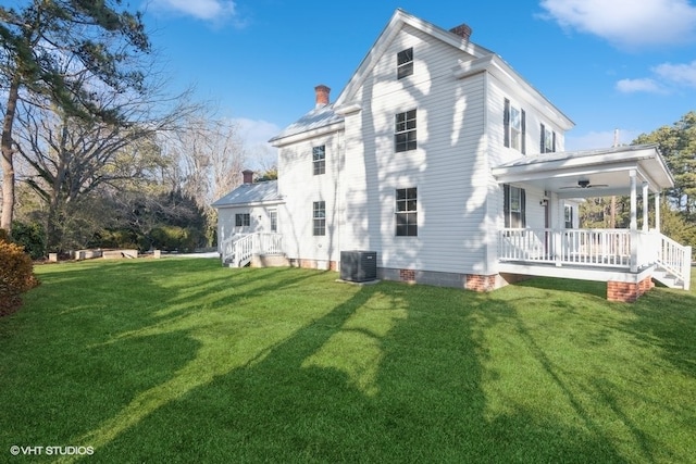 view of home's exterior with a porch, a lawn, and central air condition unit