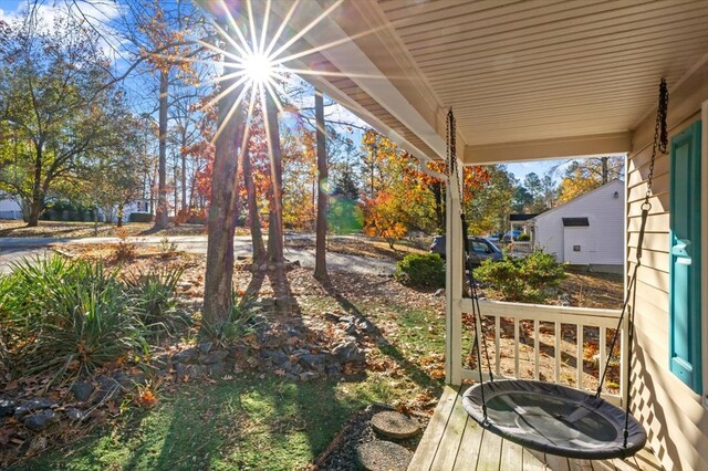 view of yard with covered porch