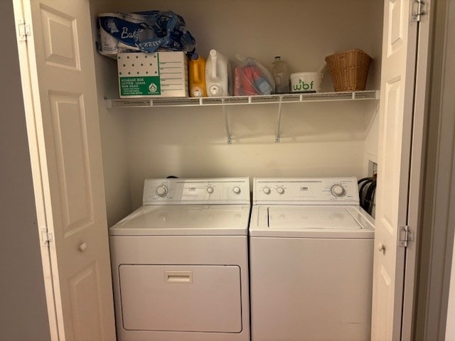 washroom featuring laundry area and washer and dryer