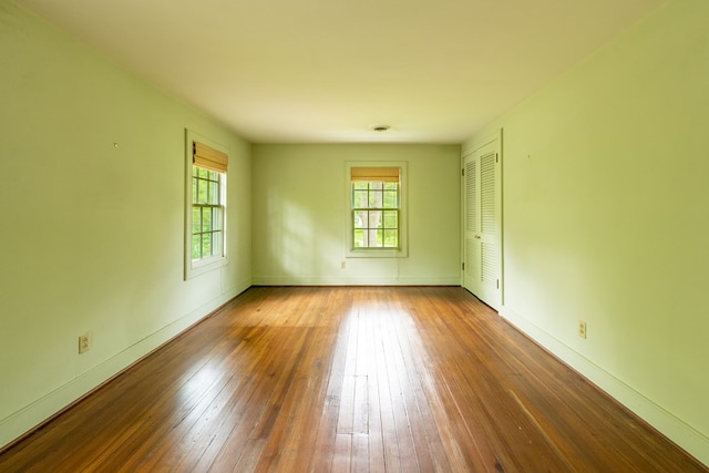 spare room featuring hardwood / wood-style flooring