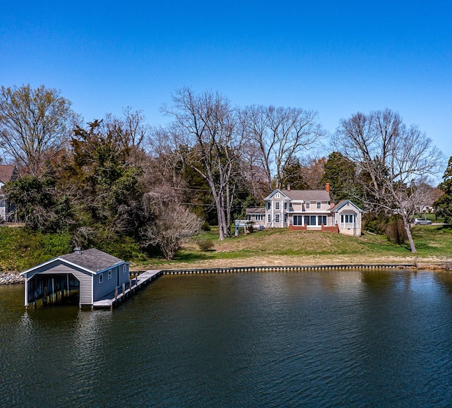 exterior space featuring a yard and a water view