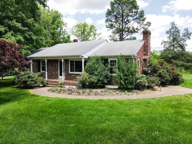 view of front of house with a porch and a front yard