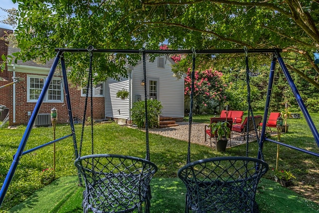 exterior space featuring a lawn and a playground