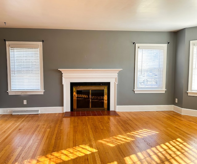 unfurnished living room featuring hardwood / wood-style floors