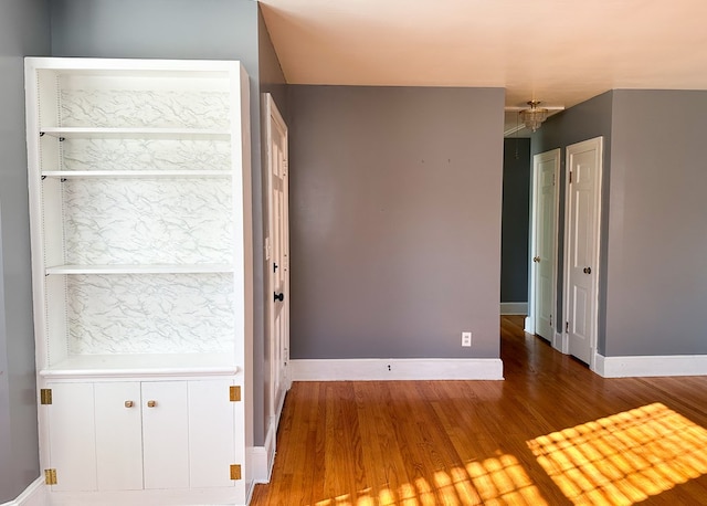 spare room featuring hardwood / wood-style flooring