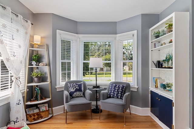 living area featuring hardwood / wood-style flooring and a wealth of natural light