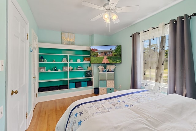 bedroom featuring wood-type flooring and ceiling fan