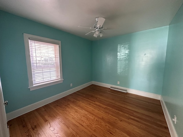 unfurnished room featuring hardwood / wood-style floors and ceiling fan