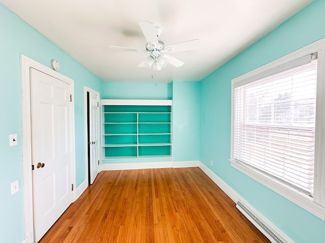 unfurnished bedroom with light hardwood / wood-style flooring, a closet, and ceiling fan