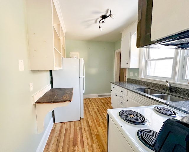 kitchen with sink, white cabinetry, light hardwood / wood-style flooring, track lighting, and white appliances