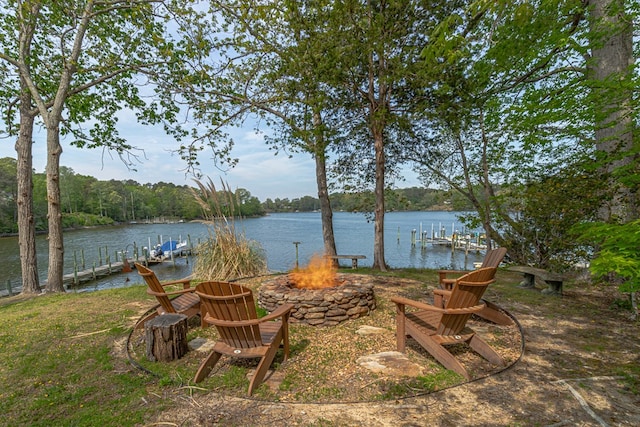 555 Rio Vis, Weems, VA 22576 - view of yard featuring an outdoor fire pit, a boat dock, and a water view