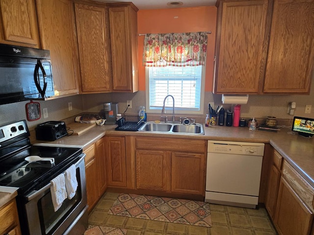 kitchen with black appliances and sink