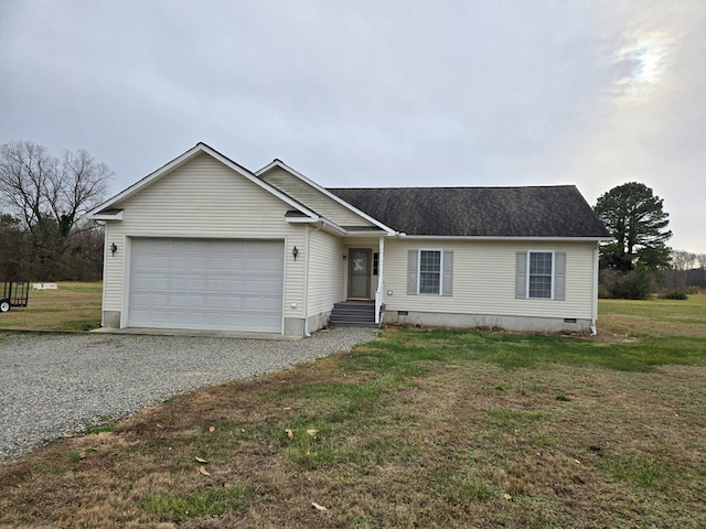 view of front facade with a garage and a front lawn