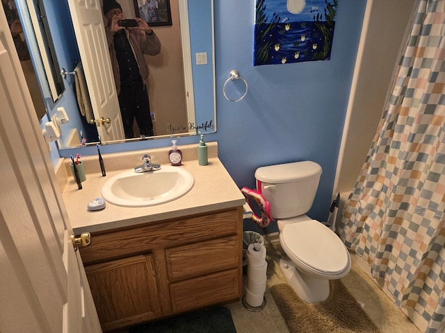 bathroom featuring vanity, a shower with shower curtain, and toilet