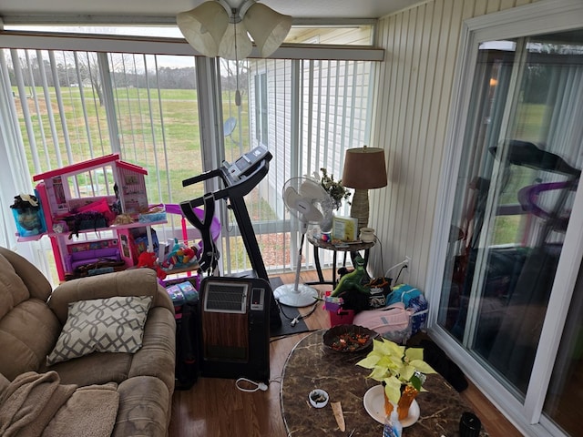 sunroom / solarium with ceiling fan