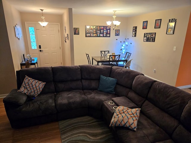 living room featuring hardwood / wood-style floors and a notable chandelier