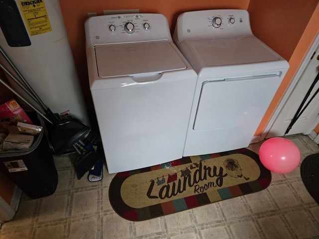 laundry room with washing machine and clothes dryer