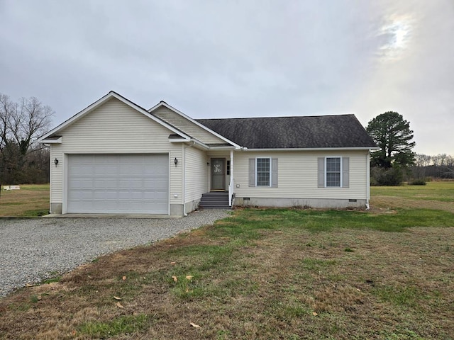 view of front of property featuring a front lawn and a garage