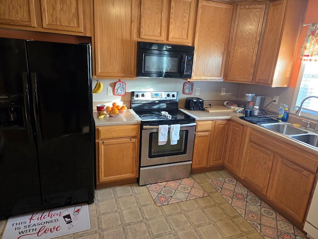 kitchen featuring sink and black appliances