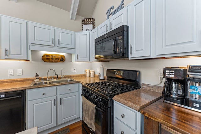 kitchen with black appliances, white cabinets, sink, dark hardwood / wood-style floors, and beam ceiling