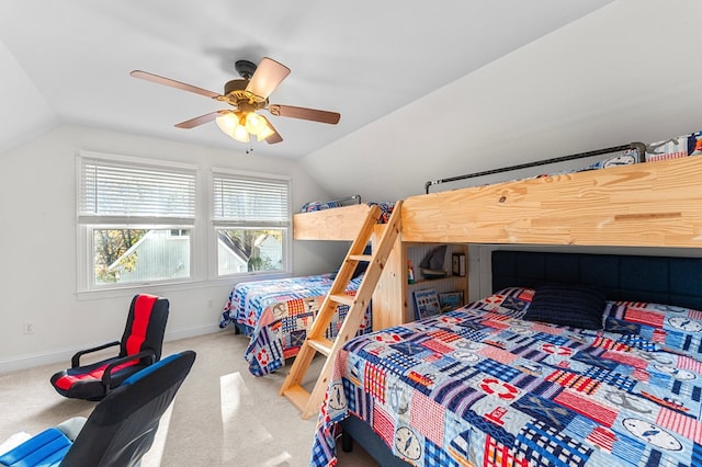 bedroom with ceiling fan, carpet, and lofted ceiling