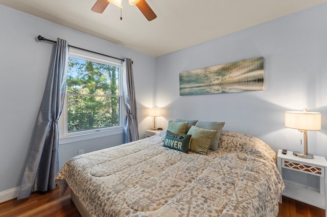 bedroom featuring dark hardwood / wood-style floors and ceiling fan