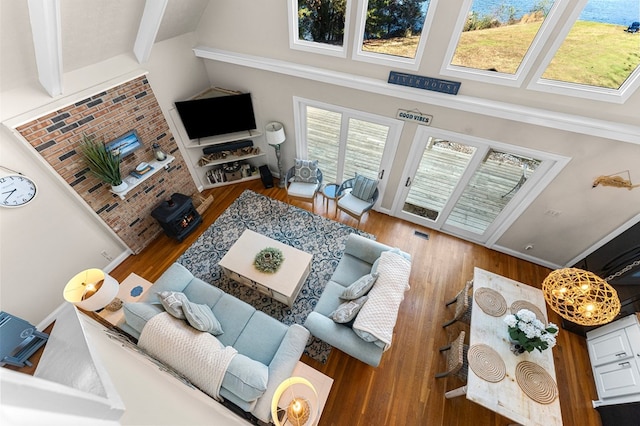 living room featuring hardwood / wood-style floors and a towering ceiling