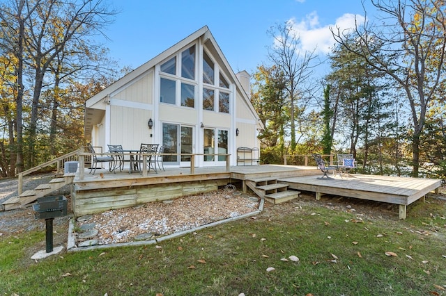 rear view of house with a wooden deck