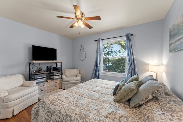 bedroom featuring hardwood / wood-style floors and ceiling fan