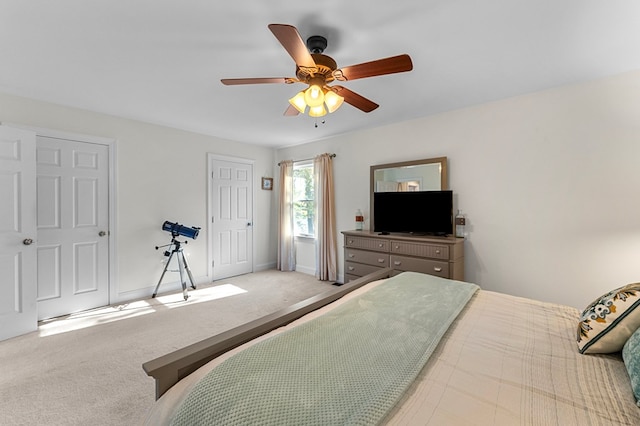 carpeted bedroom featuring ceiling fan